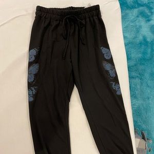 Black jogger sweatpants with blue butterflies